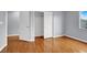 Bedroom with hardwood floors and a closet with double doors at 5246 Aurora Beam Ave, Las Vegas, NV 89122