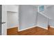 Bright bedroom featuring hardwood floors, a walk-in closet, and natural light at 5246 Aurora Beam Ave, Las Vegas, NV 89122