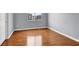 Bedroom featuring hardwood floors and window at 5246 Aurora Beam Ave, Las Vegas, NV 89122