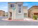 Charming two-story home with a stucco exterior and an attached garage in a residential neighborhood at 5246 Aurora Beam Ave, Las Vegas, NV 89122