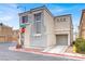 Charming two-story home with a stucco exterior and an attached garage in a residential neighborhood at 5246 Aurora Beam Ave, Las Vegas, NV 89122