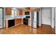 Modern kitchen with stainless steel appliances and wooden cabinets, providing style and functionality at 5246 Aurora Beam Ave, Las Vegas, NV 89122