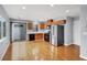 Modern kitchen with stainless steel appliances and a sliding glass door leading to the outdoors at 5246 Aurora Beam Ave, Las Vegas, NV 89122