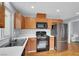 Well-equipped kitchen with modern appliances and ample counter space, perfect for cooking at 5246 Aurora Beam Ave, Las Vegas, NV 89122