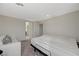 Bedroom features an unmade bed, a white sofa, and an open doorway in a neutrally decorated setting at 5691 Tinar St, Las Vegas, NV 89113
