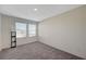 Comfortable bedroom with ample natural light and neutral carpet, perfect for relaxation at 5691 Tinar St, Las Vegas, NV 89113