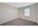 Carpeted bedroom featuring a window and neutral walls at 5691 Tinar St, Las Vegas, NV 89113