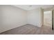 Bedroom features a double door closet, soft carpeting, and an open door way for easy access at 5691 Tinar St, Las Vegas, NV 89113