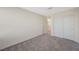 This bedroom boasts neutral walls, carpet, and a closet, providing a serene living space at 5691 Tinar St, Las Vegas, NV 89113