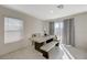 Dining area with a modern table, bench seating, and natural light from a sliding door at 5691 Tinar St, Las Vegas, NV 89113