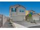 Charming two-story home showcasing a well-manicured yard, attached two car garage, and neutral color palette at 5691 Tinar St, Las Vegas, NV 89113