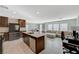 Open-concept kitchen features stainless appliances, a large island, and seamless flow to the living area at 5691 Tinar St, Las Vegas, NV 89113