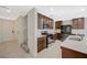 Modern kitchen featuring stainless steel appliances, dark cabinets, and bright white countertops at 5691 Tinar St, Las Vegas, NV 89113