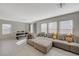 Spacious living room with a sectional sofa, providing ample seating and natural light at 5691 Tinar St, Las Vegas, NV 89113