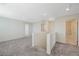 Upstairs loft area with neutral carpeting and easy access to multiple rooms at 5691 Tinar St, Las Vegas, NV 89113