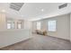 Loft area with carpet, multiple windows, and bench seating with decorative pillows at 5691 Tinar St, Las Vegas, NV 89113