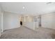 Upstairs loft space showcasing carpet flooring, access to rooms, and neutral colors at 5691 Tinar St, Las Vegas, NV 89113