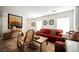 Cozy living room features a red couch and stylish furnishings at 653 Del Giorno St, Las Vegas, NV 89138