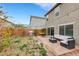 Backyard featuring a patio area, outdoor furniture, grill and partial views of the home at 6619 Frosted Harvest Ave, Las Vegas, NV 89108