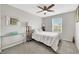 Serene bedroom with soft carpet, stylish furniture, and lots of natural light at 6619 Frosted Harvest Ave, Las Vegas, NV 89108