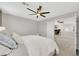 Bedroom features a ceiling fan, carpet, ensuite bathroom and loft access at 6619 Frosted Harvest Ave, Las Vegas, NV 89108