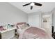 Cozy bedroom features neutral walls, ceiling fan, carpet and closet at 6619 Frosted Harvest Ave, Las Vegas, NV 89108