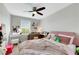 Bedroom with a ceiling fan, neutral walls, carpet and natural light at 6619 Frosted Harvest Ave, Las Vegas, NV 89108