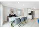 Dining room with a modern white table and stylish gold-accented chairs at 6619 Frosted Harvest Ave, Las Vegas, NV 89108