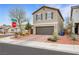 Attractive two-story home with desert landscaping, a brown two-car garage, and a well-kept front yard at 6619 Frosted Harvest Ave, Las Vegas, NV 89108