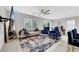 Bright living room with stylish blue accents and a large area rug at 6619 Frosted Harvest Ave, Las Vegas, NV 89108