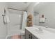 Bright bathroom features a shower-tub combo and a vanity with a white countertop at 6645 Churnet Valley Ave, Las Vegas, NV 89139