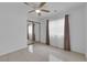 Bedroom features tile flooring, mirrored closet, ceiling fan, and a bright and inviting atmosphere at 738 Panhandle Dr, Henderson, NV 89014