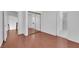Bedroom featuring wood floors, mirrored closet, and access to en-suite bathroom, designed for comfort at 738 Panhandle Dr, Henderson, NV 89014