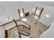 An entryway with staircase, light tile flooring, and a partial view of the living room at 738 Panhandle Dr, Henderson, NV 89014