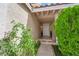 Inviting front entry featuring a tiled porch and mature landscaping at 738 Panhandle Dr, Henderson, NV 89014
