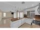 Modern kitchen with stainless steel appliances, granite countertops, breakfast bar, and adjacent living area at 738 Panhandle Dr, Henderson, NV 89014