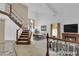 Bright, open living room with staircase, fireplace, and dining area at 738 Panhandle Dr, Henderson, NV 89014