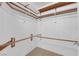 Spacious walk-in closet offering ample storage space with multiple rods and shelving units at 738 Panhandle Dr, Henderson, NV 89014
