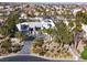 This aerial view showcases lush landscaping, mature trees, and a circular driveway at 7436 Oak Grove Ave, Las Vegas, NV 89117