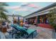 Backyard with patio, lounge chairs, pool, and built in cooking space at 7436 Oak Grove Ave, Las Vegas, NV 89117