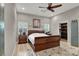 This cozy bedroom features a ceiling fan, an area rug, and an ensuite walk-in closet at 7436 Oak Grove Ave, Las Vegas, NV 89117