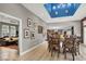 Elegant dining room with stylish decor, wood floors, and easy access to living spaces at 7436 Oak Grove Ave, Las Vegas, NV 89117