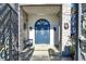 Elegant blue front door with stone accents and a welcoming covered entrance at 7436 Oak Grove Ave, Las Vegas, NV 89117
