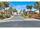 A stunning single-story home featuring a long driveway and elegant landscaping at 7436 Oak Grove Ave, Las Vegas, NV 89117