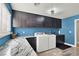 This laundry room has a sink, washer, dryer, and blue walls at 7436 Oak Grove Ave, Las Vegas, NV 89117