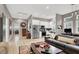 Bright open-concept living room and kitchen with stainless appliances and hardwood floors at 7436 Oak Grove Ave, Las Vegas, NV 89117