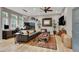 Spacious living room boasts wood floors, modern lighting, and seamless flow to the outdoors at 7436 Oak Grove Ave, Las Vegas, NV 89117