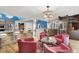 Open-concept living space with modern lighting, stainless appliances and stylish furniture at 7436 Oak Grove Ave, Las Vegas, NV 89117