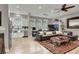 Open-concept living room with wood floors, ample natural light, and a modern, stylish design at 7436 Oak Grove Ave, Las Vegas, NV 89117