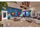 Bright living room showcasing modern decor, unique lighting fixtures, and seamless access to a stunning outdoor patio area at 7436 Oak Grove Ave, Las Vegas, NV 89117